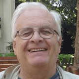 Portrait photo of John White smiling