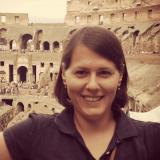 Portrait photo of Rita Simon standing at the Colosseum